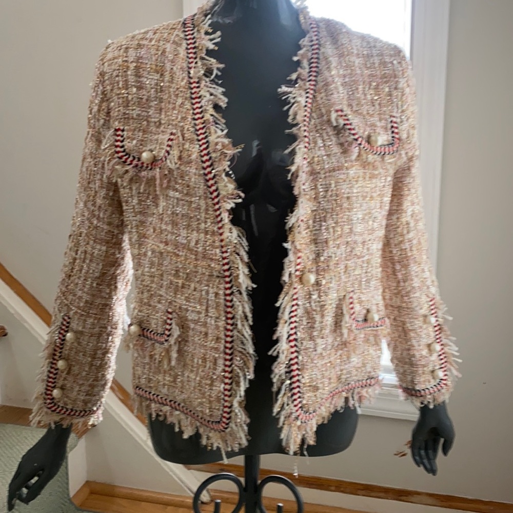 Short decorative  jacket with pearl accents.